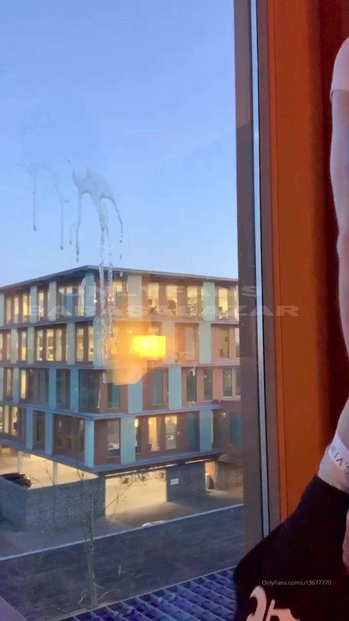 Sara shooting it on a window